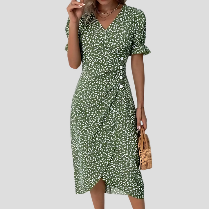 Robe femme midi à motifs de fleurs, encolure V et manches bouffantes, pour une tenue estivale fluide.