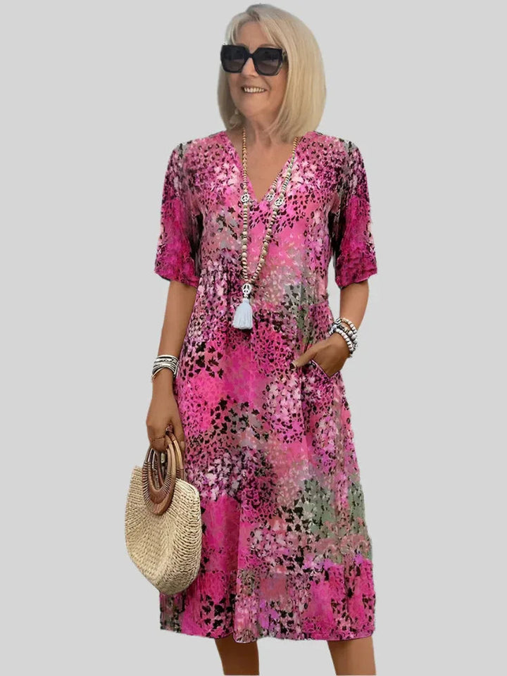 Robe midi évasée femme avec col V, élégante et confortable, idéale pour printemps-été.