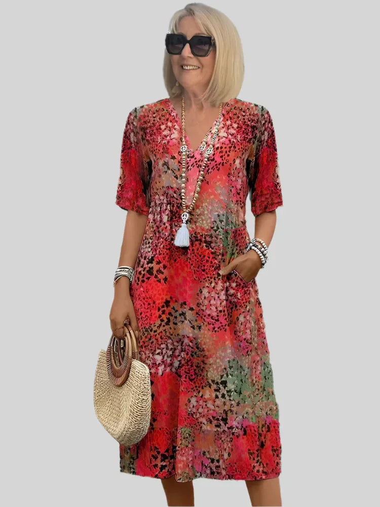 Robe midi élégante à col V et jupe évasée pour femme, idéale printemps-été, avec poches pratiques.