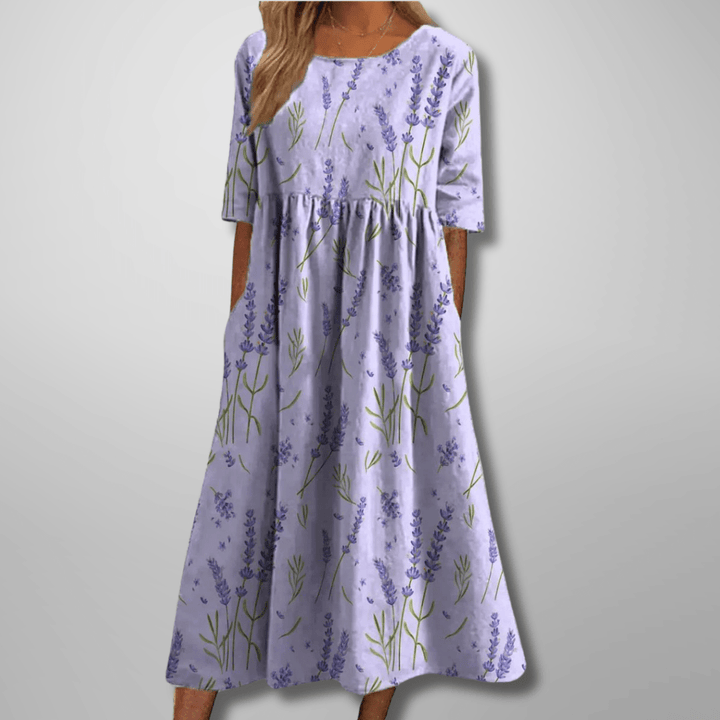 Élégante robe midi imprimée à col rond pour femme, manches courtes, idéale pour une tenue chic et confortable.