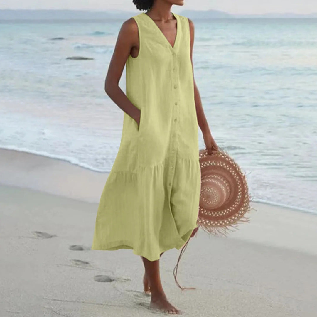 Élégante robe midi fluide femme sans manches, idéale pour un confort décontracté en été.