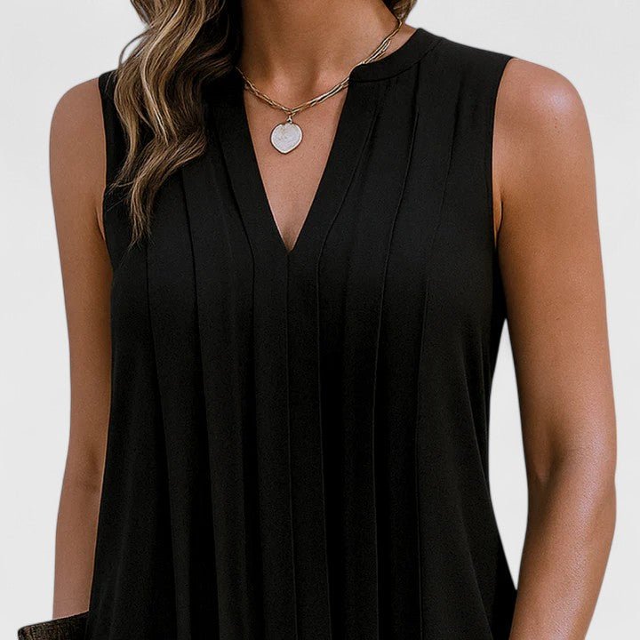 Robe midi femme confortable, col V, sans manches. Style estival, élégant et féminin pour la mode.