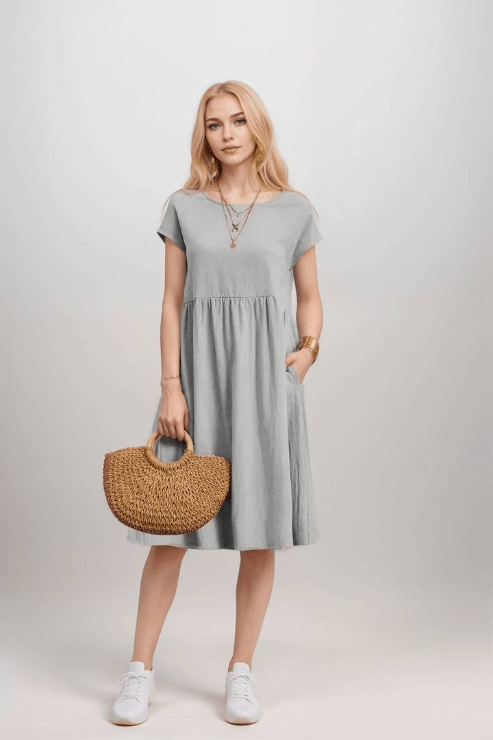 Robe trapèze midi femme à manches courtes avec poches, un vêtement élégant et décontracté pour l'été.