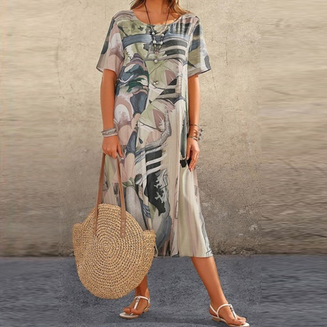 Élégante robe trapèze midi imprimée et fluide pour femme, idéale pour un style bohème décontracté au quotidien.