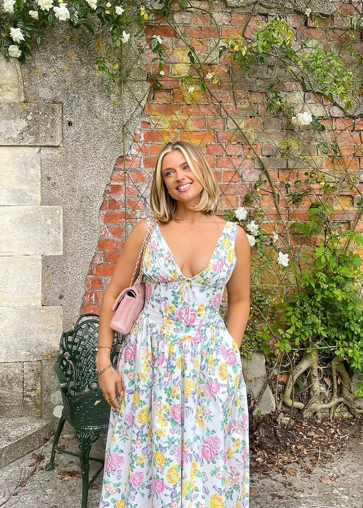 Robe décontractée midi trapèze fleurie, sans manches, pour femme, confortable et chic.