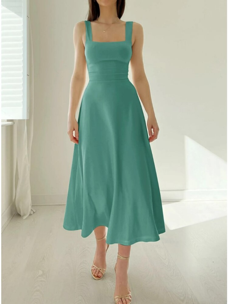 Robe midi trapèze femme, tissu confortable et léger, sans manches, élégance chic pour l'été.