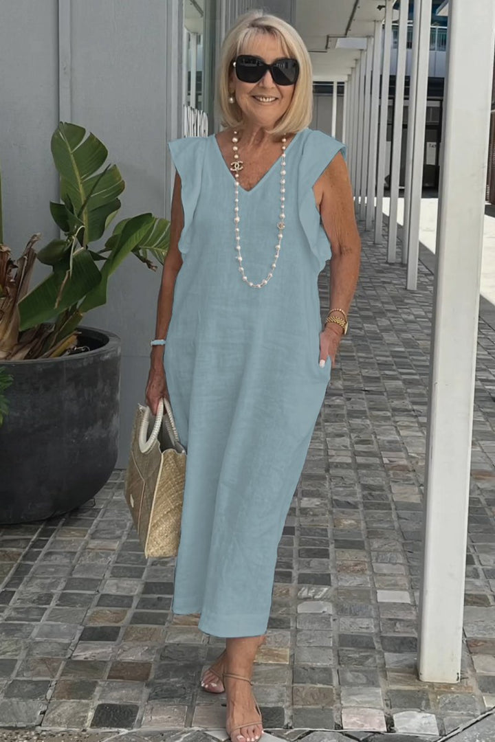 Robe élégante sans manches pour femme, un look chic et tendance pour l'été. Style midi polyvalent.