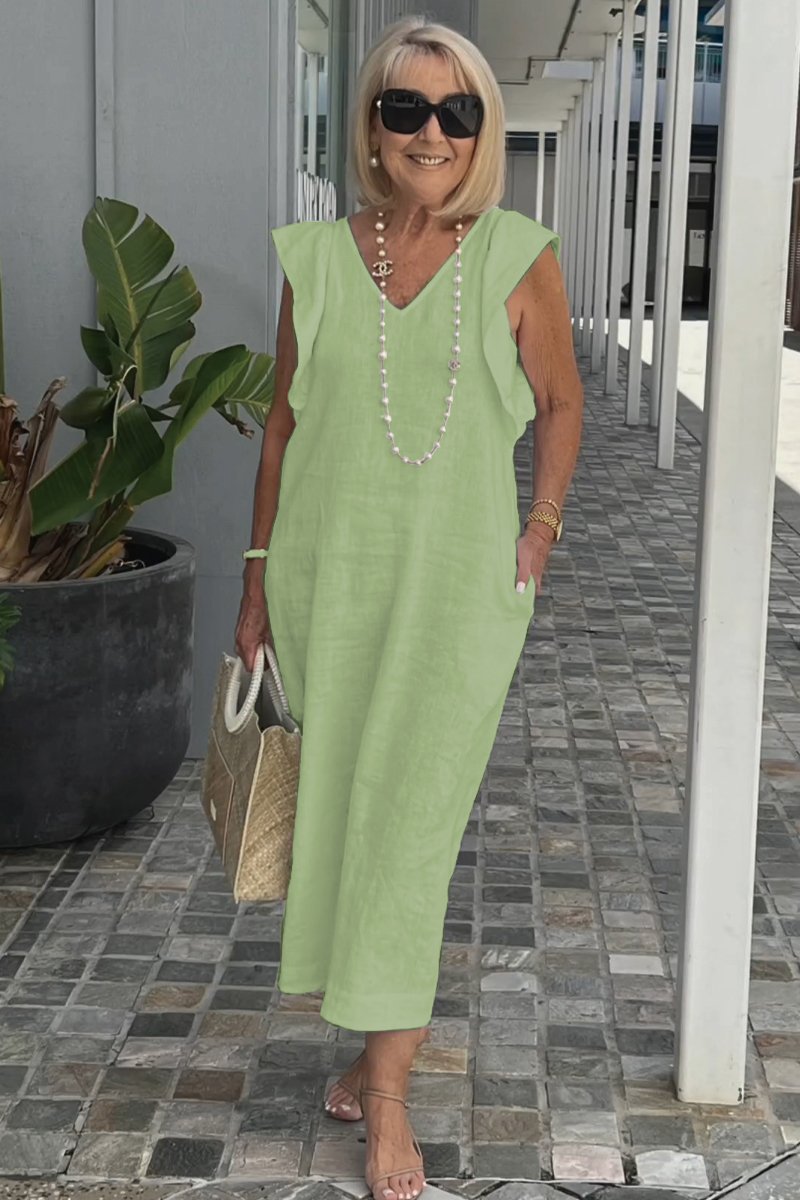 Tenue d'été femme : robe chic sans manches, confortable et moderne. Parfaite pour les journées ensoleillées.