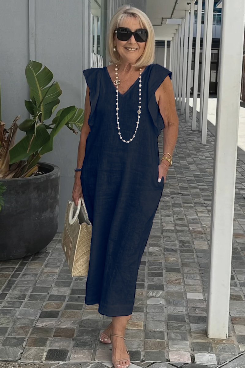 Robe d'été chic sans manches en tissu léger pour femme, confortable et élégante. Style midi décontracté.