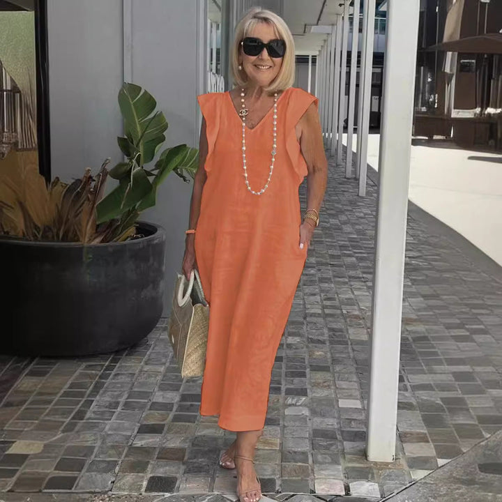 Robe d'été décontractée-chic sans manches à col en V pour femme, idéale pour les sorties estivales.