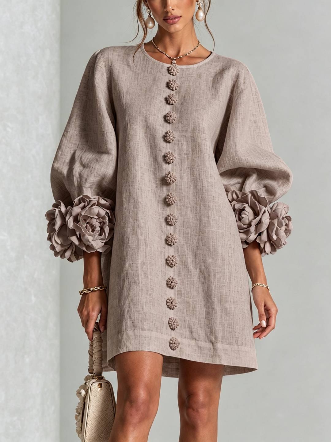 Robe rose d'été, coupe trapèze, manches 3/4, tissu effet lin fluide, pour un style raffiné.