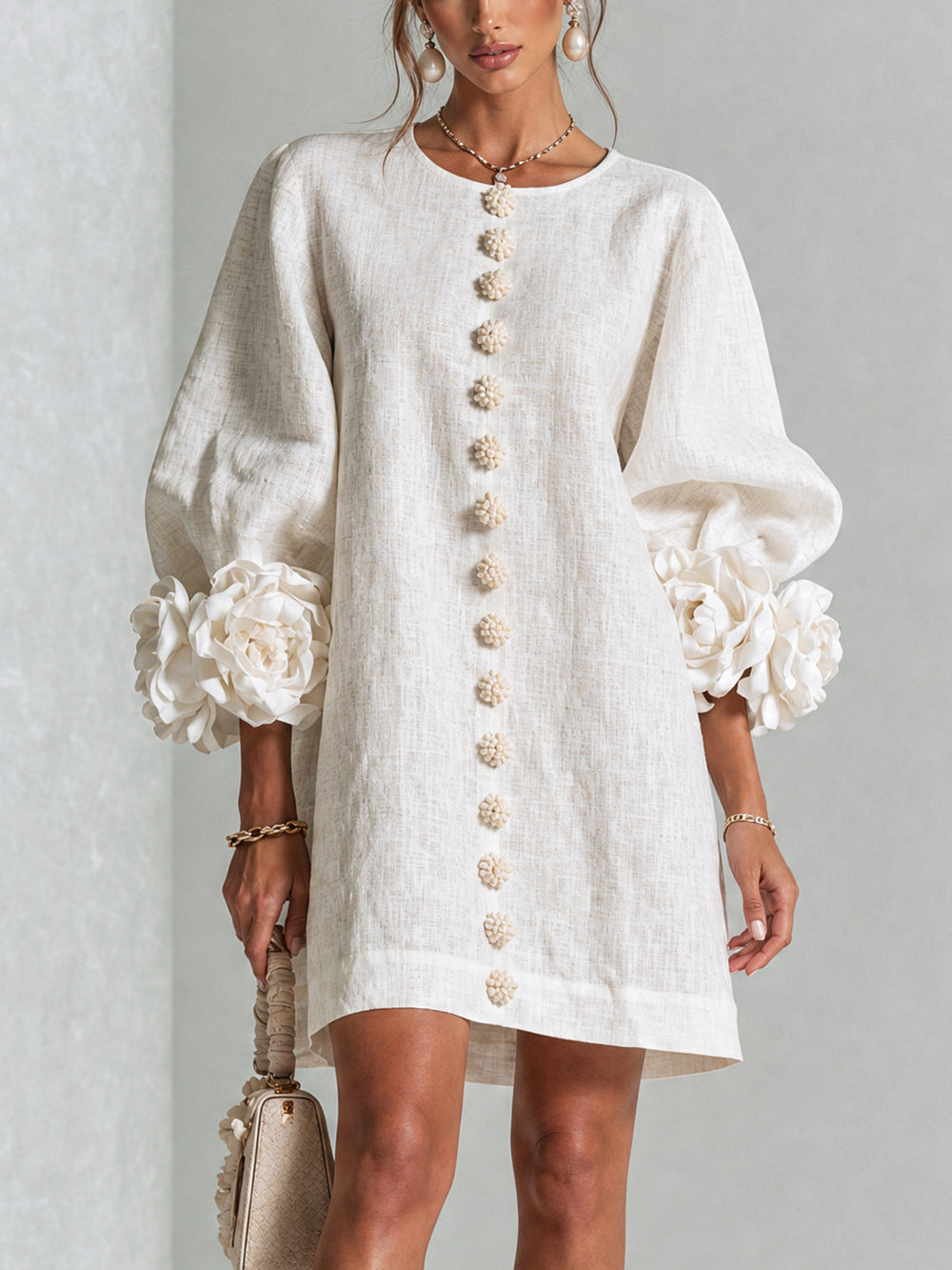 Robe boutonnée rose femme coupe trapèze, manches trois-quarts, tissu effet lin décontracté.