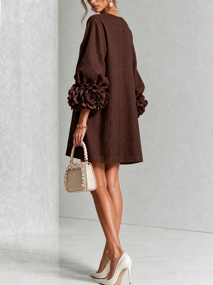 Robe rose d'été fluide, coupe trapèze, manches trois-quarts, effet lin, confort et style.