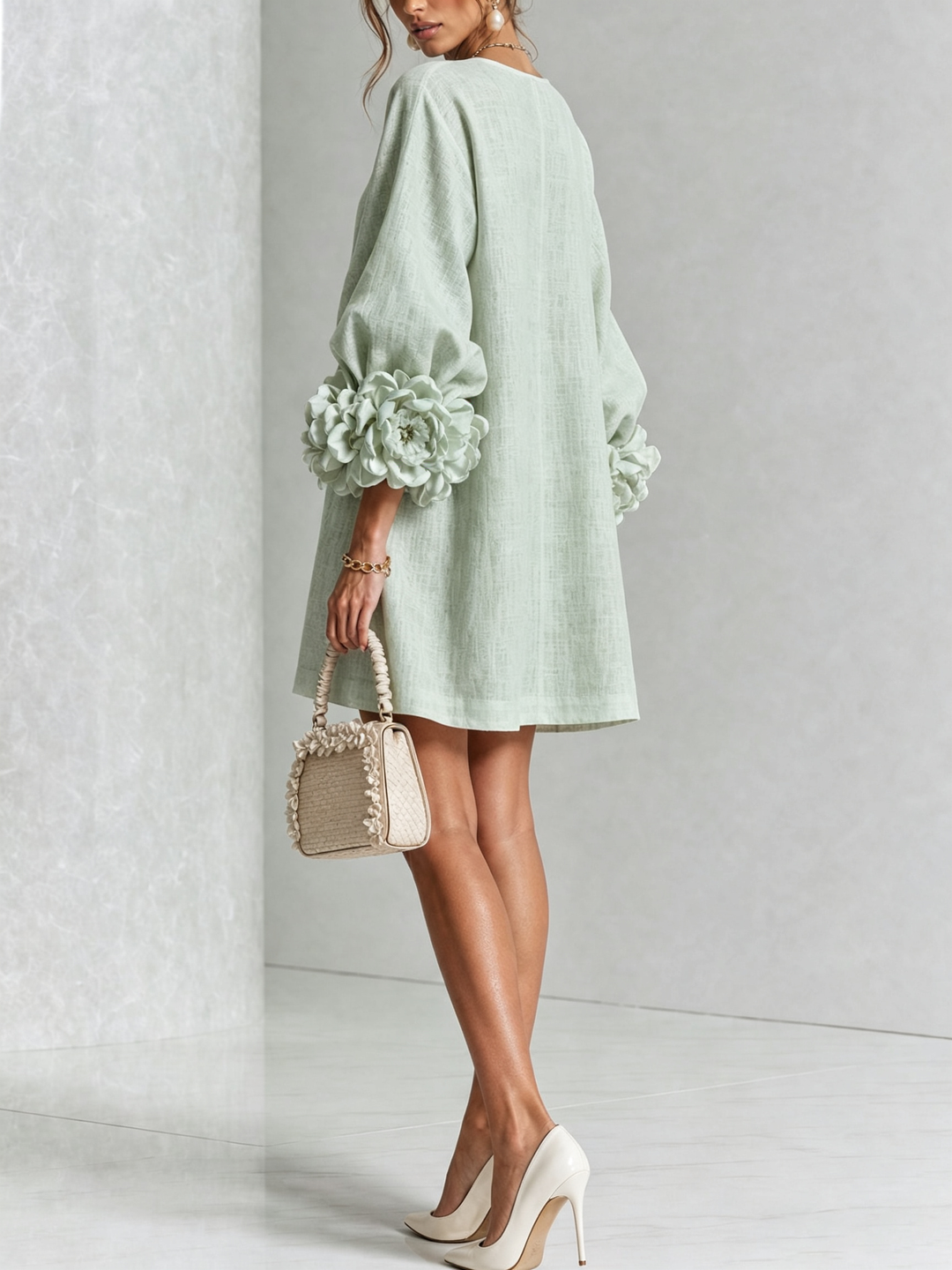 Robe rose fluide boutonnée, manches trois-quarts, effet lin, coupe trapèze, look estival léger.