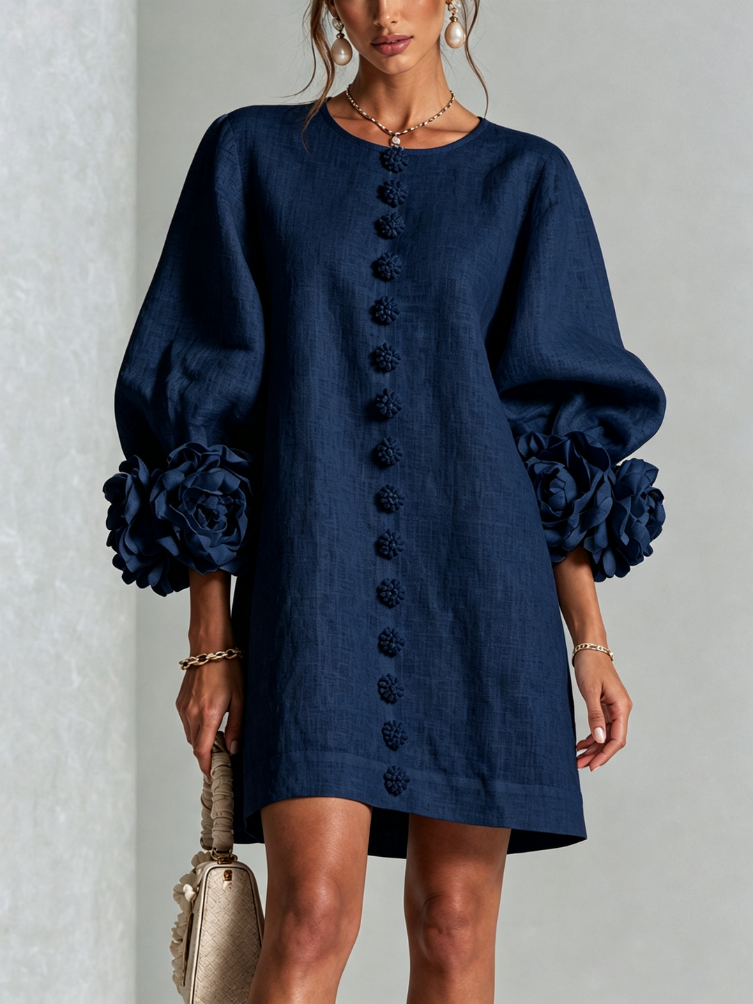 Robe femme rose effet lin, coupe trapèze, manches 3/4, boutonnée, idéale pour l'été.