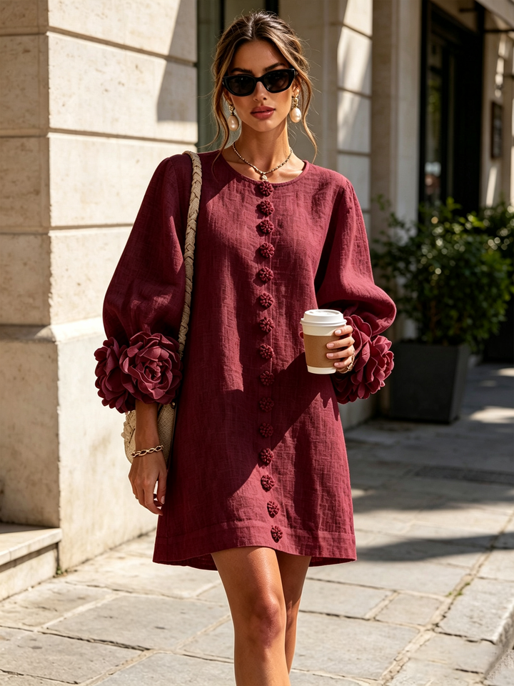 Robe femme rose effet lin, boutonnée, manches 3/4, coupe trapèze, style chic et confortable.