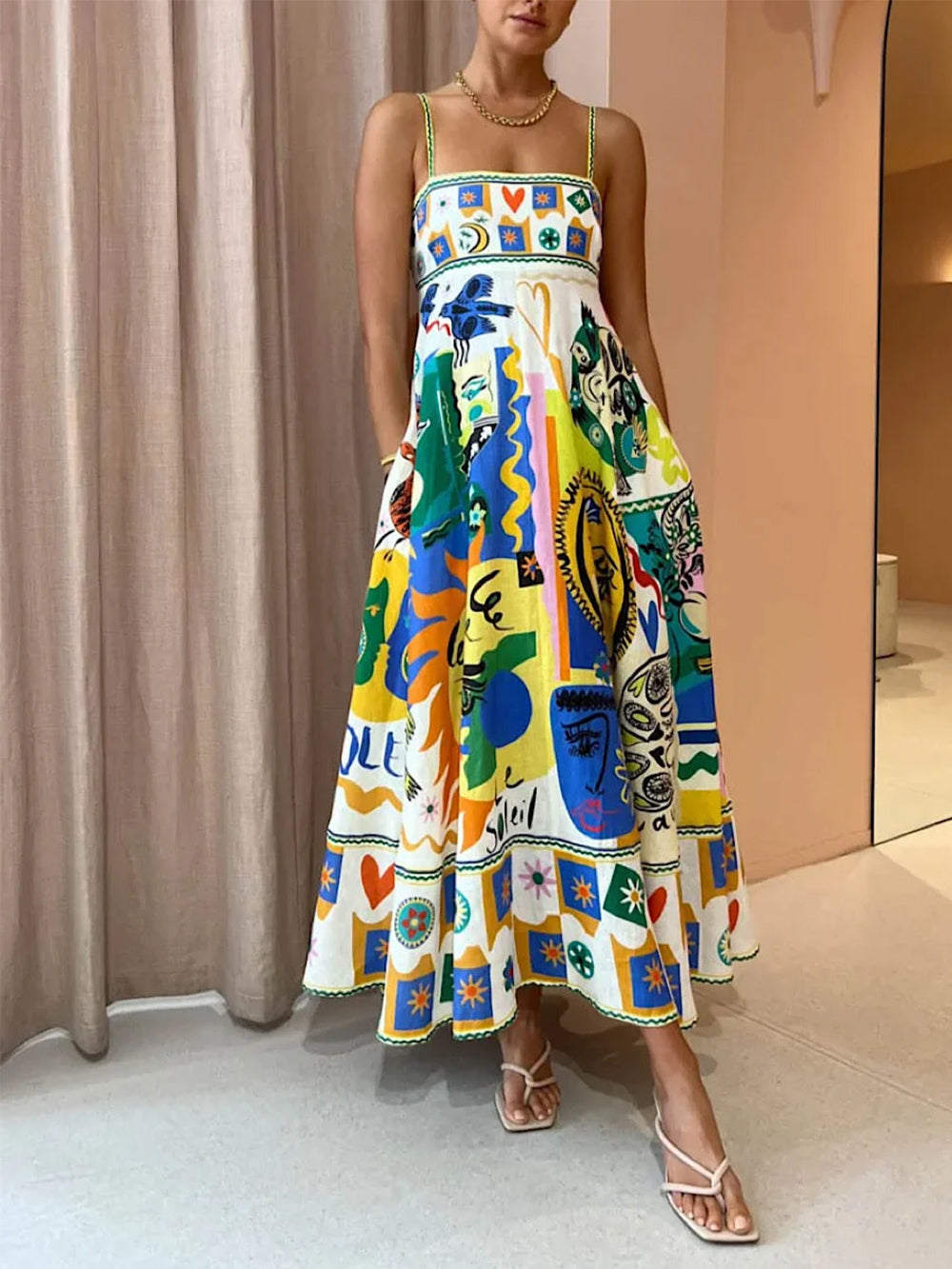 Robe trapèze maxi femme, coupe fluide sans manches, couleur jaune imprimée, pour un confort élégant en été.