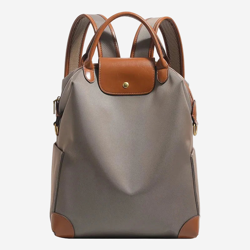 Sac à dos femme élégant en cuir véritable, rabat, pour travail ou quotidien chic.