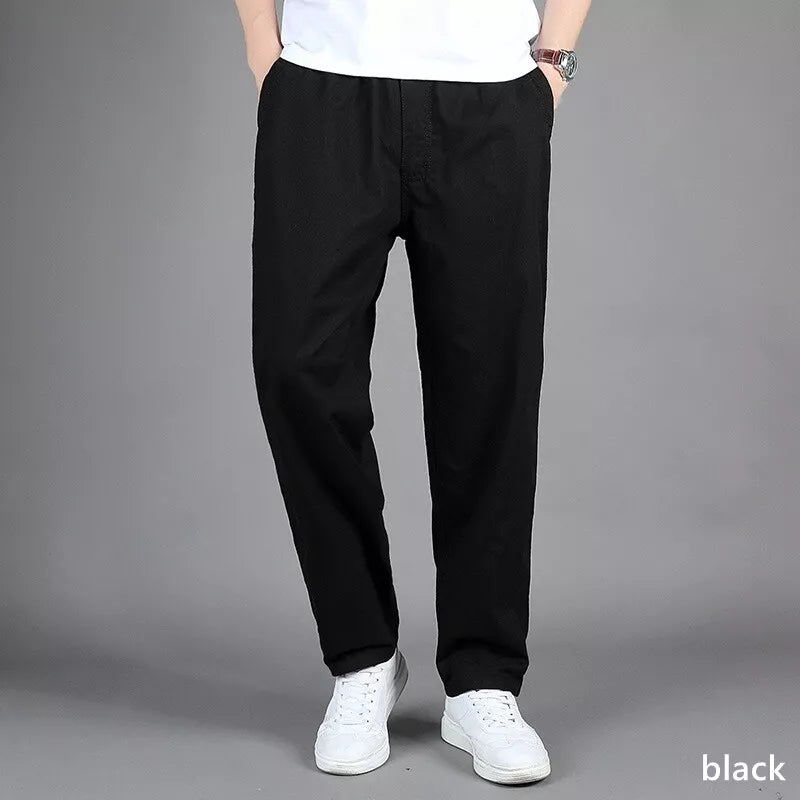 Pantalon ample homme en lin décontracté avec taille élastique et poches zippées, parfait printemps/été.