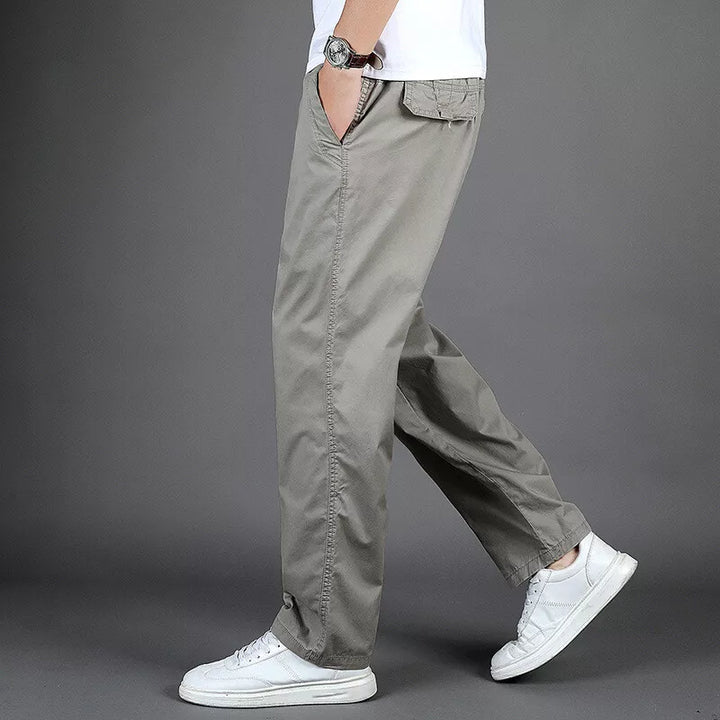 Pantalon oversize homme décontracté en lin avec poches zippées, idéal pour un style urbain confortable.