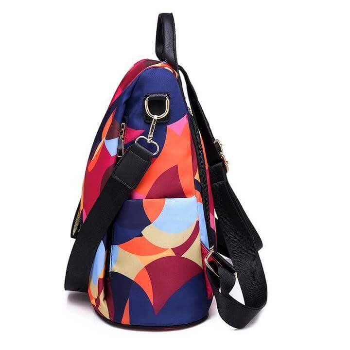 Sac à dos femme rouge multicolore, antivol, élégant, parfait pour accessoire de voyage ou usage quotidien.