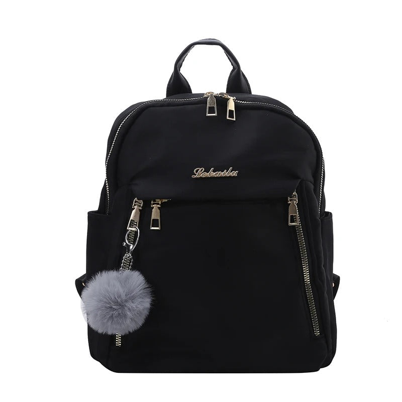 Sac à dos de voyage femme noir, spacieux et chic, accessoire mode essentiel pour vos déplacements.