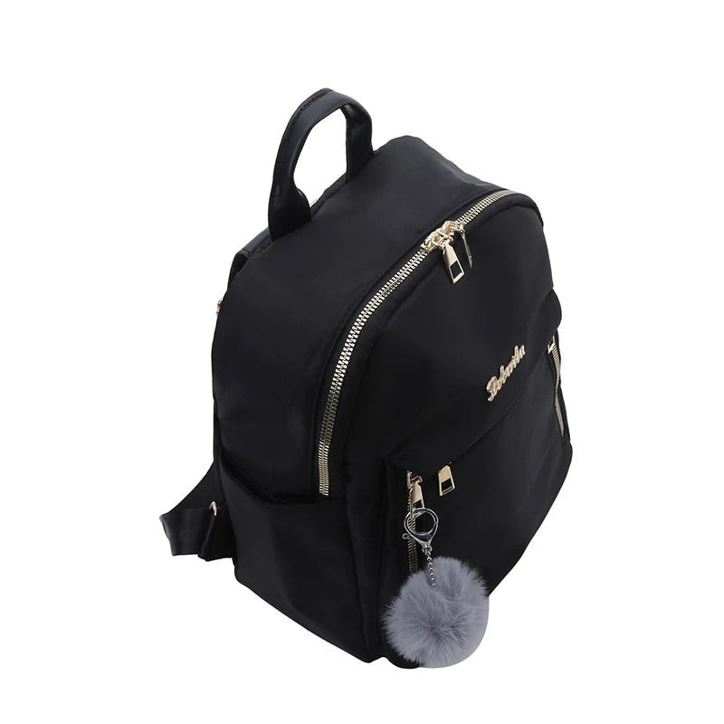 Sac à dos femme noir avec organisateur, élégant et pratique pour vos essentiels quotidiens et voyage.