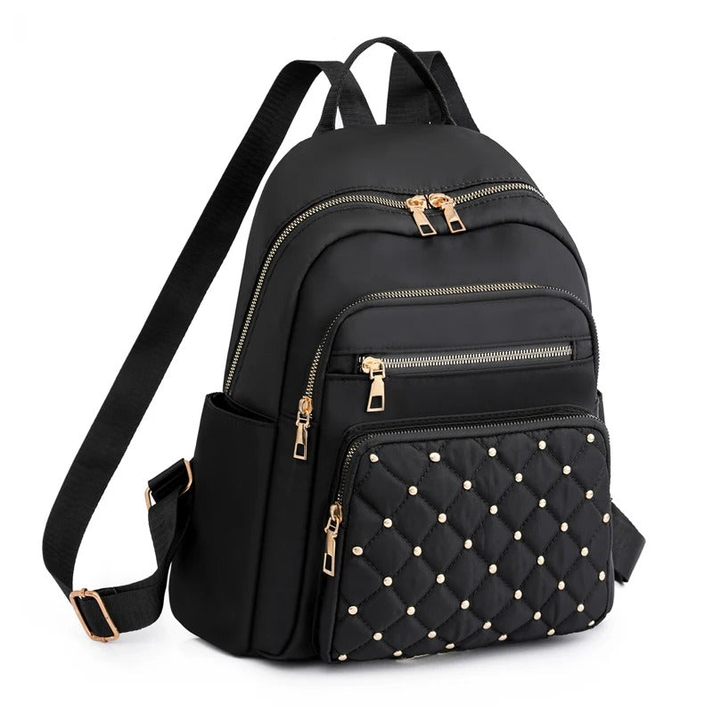 Sac à dos femme léger et imperméable en nylon pour voyage ou études, avec multiples compartiments.