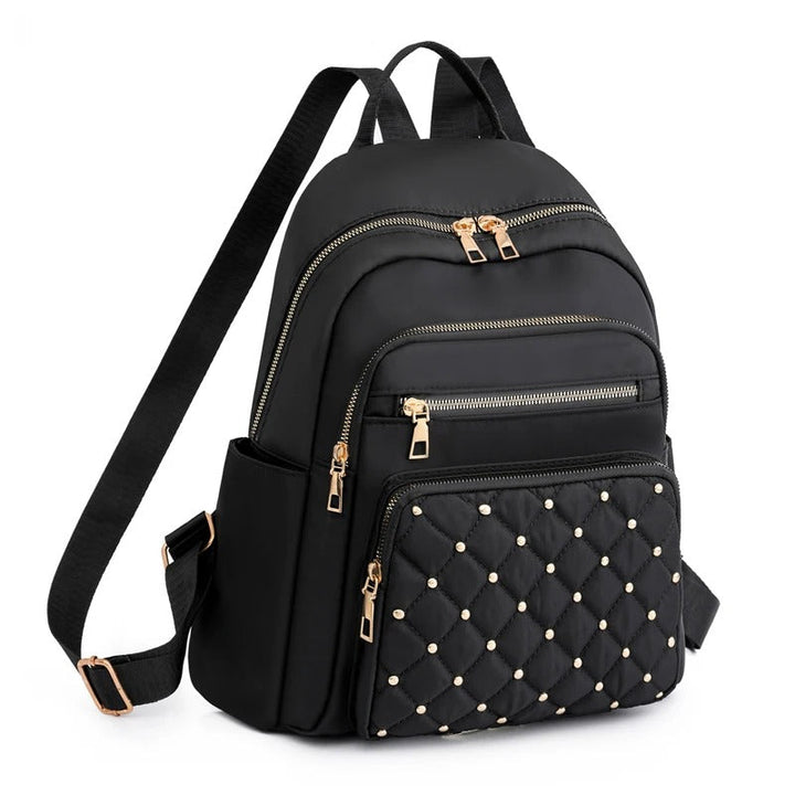 Sac à dos femme léger et imperméable en nylon pour voyage ou études, avec multiples compartiments.