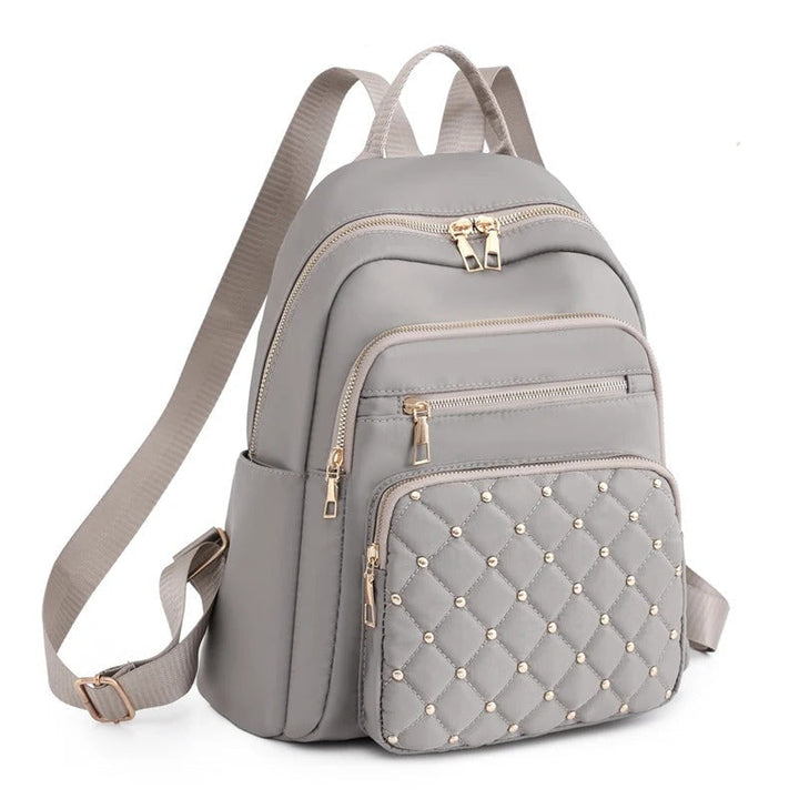Sac à dos voyage femme imperméable en nylon léger, idéal pour les aventures et usage quotidien.