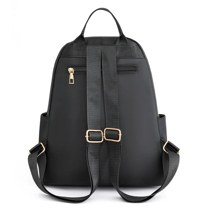 Sac à dos femme nylon léger imperméable, sac de voyage ou école, accessoire organisateur pratique.