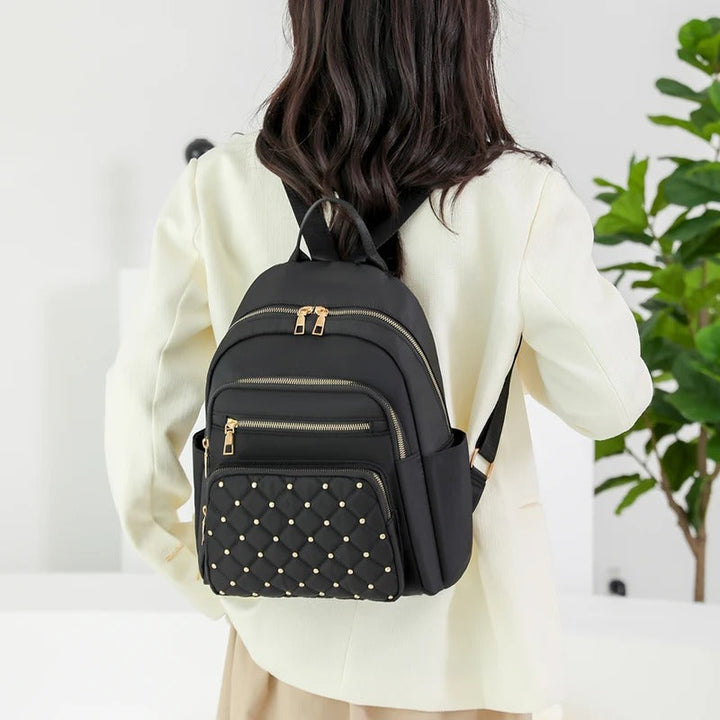 Sac à dos femme léger, imperméable, avec poches organisatrices pour voyages, études et usage quotidien.