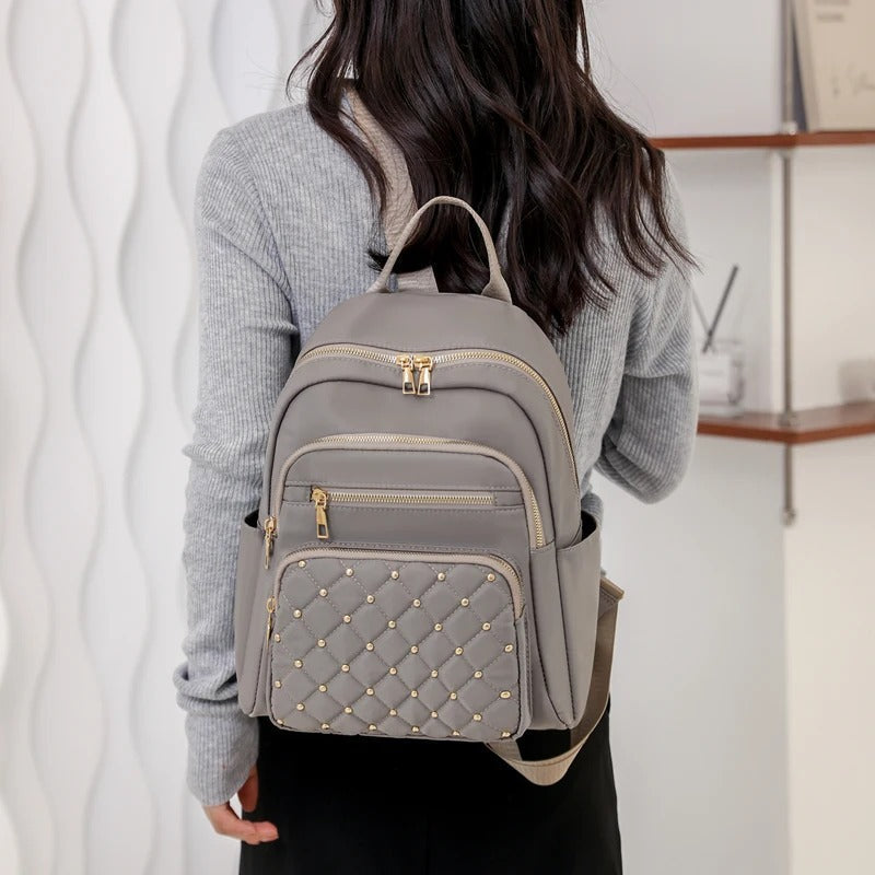Sac à dos femme polyvalent, léger, imperméable en nylon, pour école, voyage et usage quotidien.