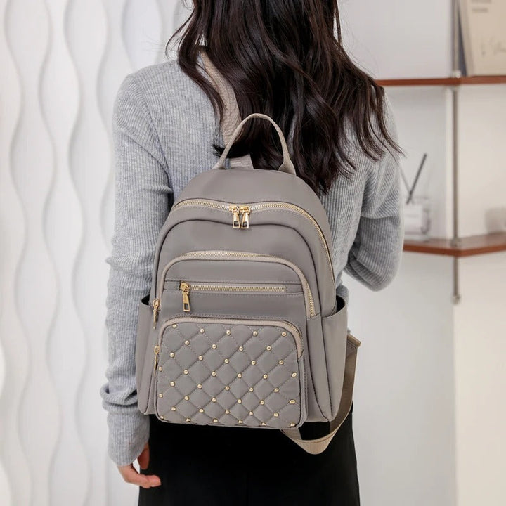 Sac à dos femme polyvalent, léger, imperméable en nylon, pour école, voyage et usage quotidien.