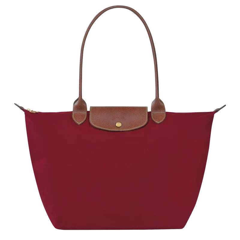 Sac élégant rouge, pliable. Un accessoire femme pratique pour toutes les occasions, du shopping au voyage.