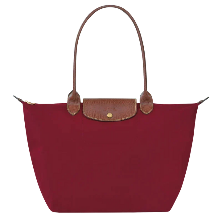 Sac élégant rouge, pliable. Un accessoire femme pratique pour toutes les occasions, du shopping au voyage.