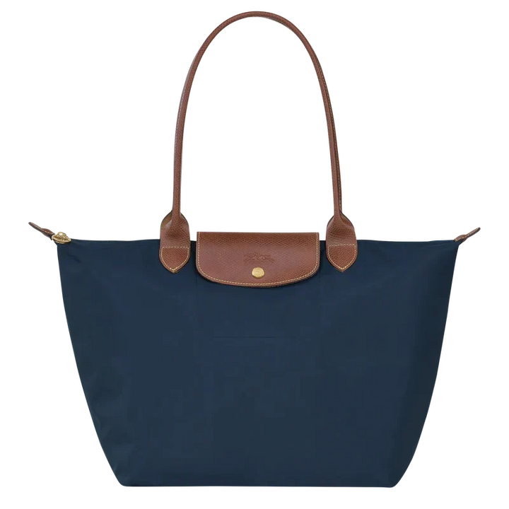 Sac shopping bleu foncé, grand et pliable. Idéal pour le marché ou comme sac d'appoint de voyage pratique.