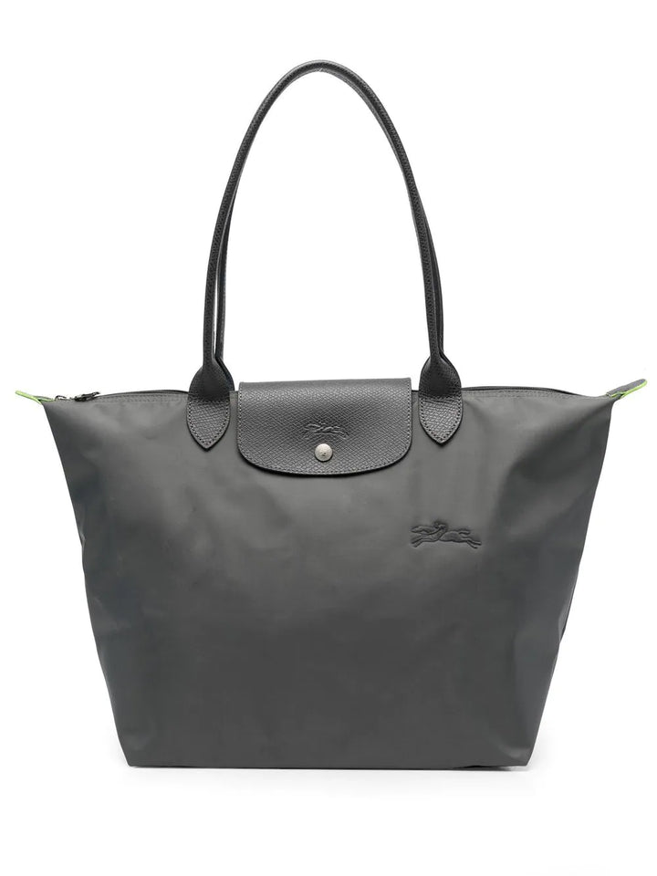 Sac grand format vert foncé, pliable. Un compagnon élégant et pratique pour le quotidien ou le week-end.