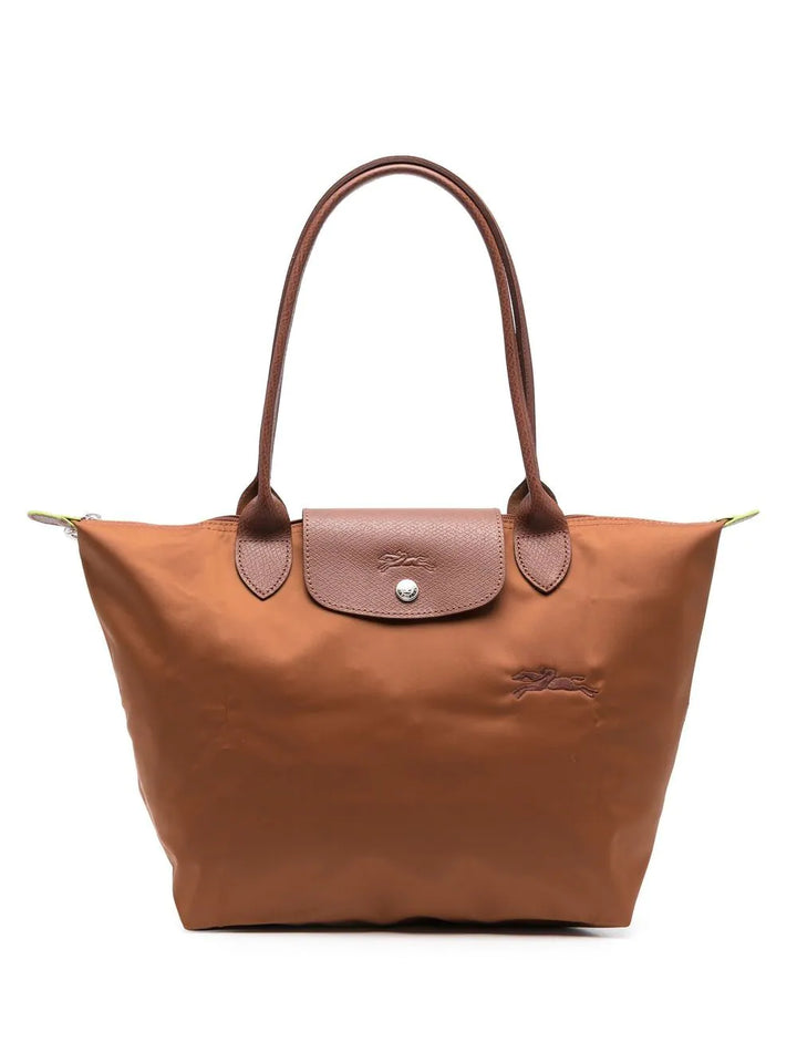 Sac à main rouge pliable, accessoire chic et pratique. Idéal pour le voyage, le shopping ou la vie quotidienne.