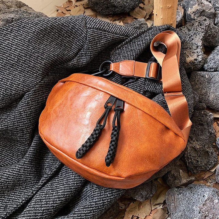 Sac banane femme en cuir PU avec bandoulière ajustable. Un accessoire pratique et mode pour toutes.