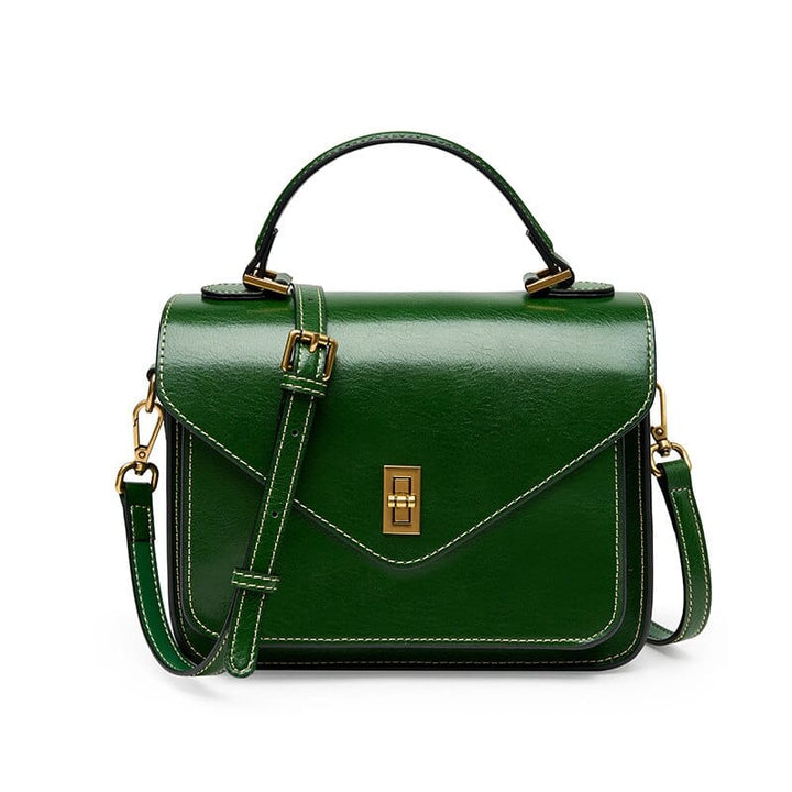 Élégant sac bandoulière Adele en cuir pour femme, avec compartiments pour une organisation facile.