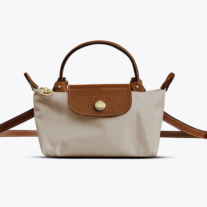 Sac bandoulière femme beige élégant, style chic, accessoire mode féminine avec sangle réglable pour le quotidien.