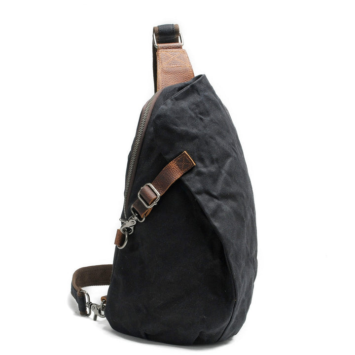Sac bandoulière homme noir étanche, style urbain, idéal pour voyage sécurisé.