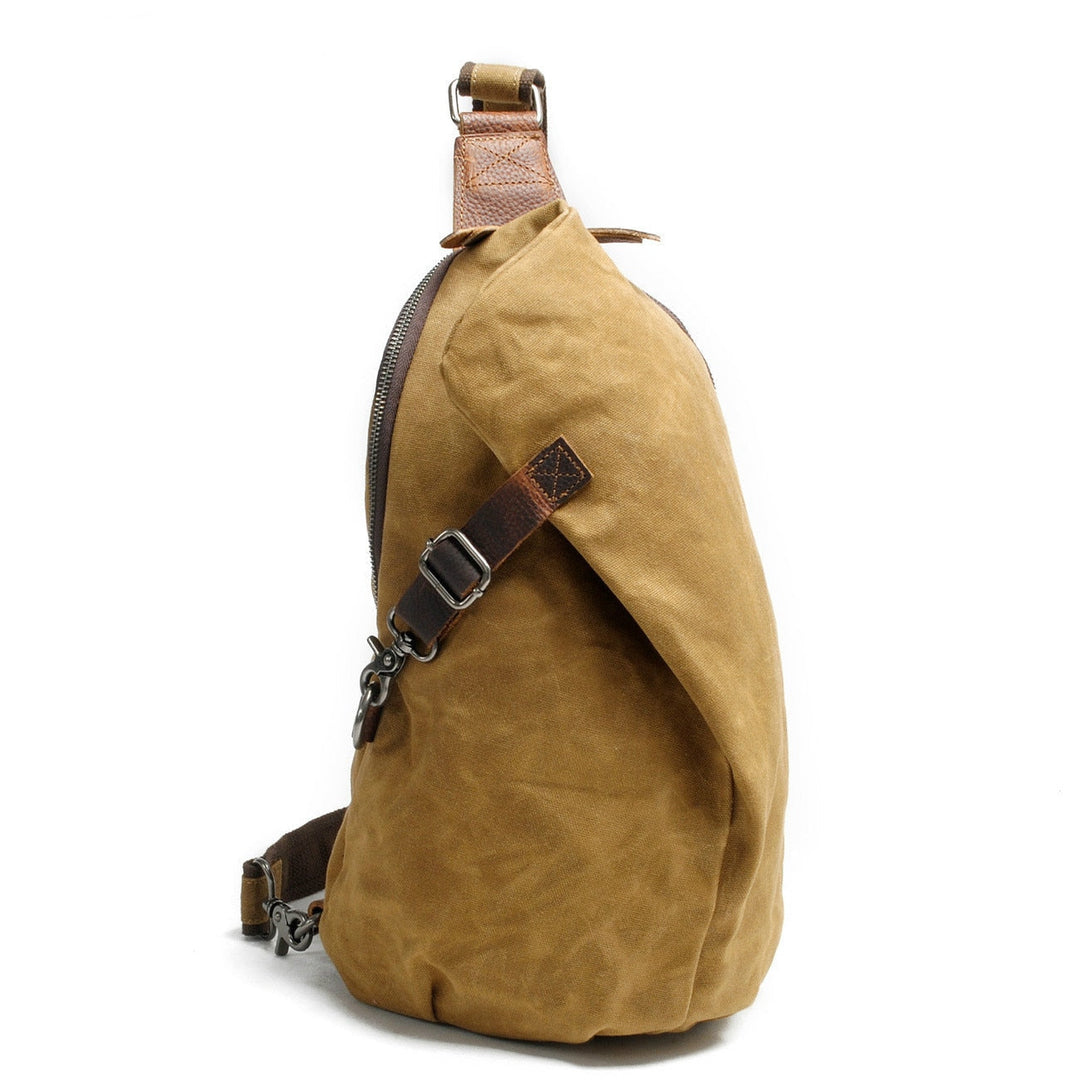 Sac bandoulière vert militaire, imperméable, pratique pour déplacements urbains.