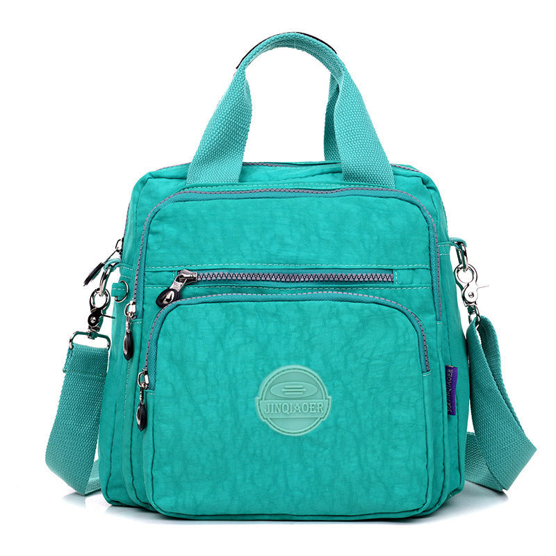 Sac bandoulière multifonctionnel imperméable, idéal pour organiser vos affaires en voyage, protection pluie.