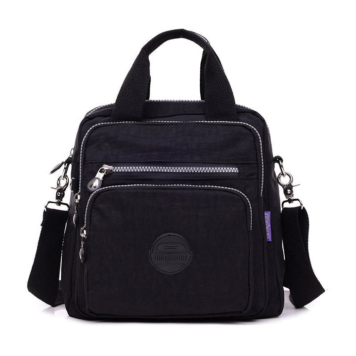 Sac imperméable élégant pour femmes, style bandoulière, épaule ou sac à main, chic et fonctionnel.