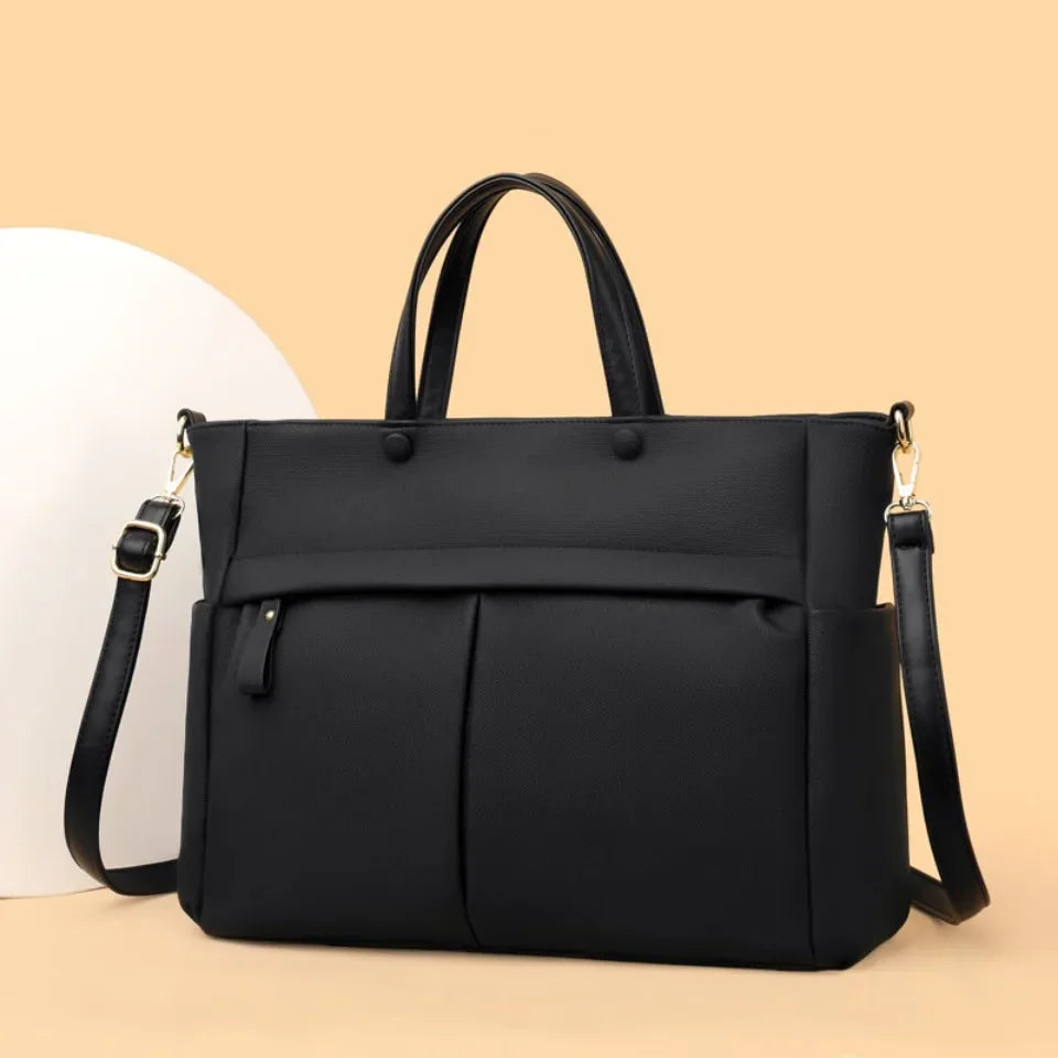 Sac Élise couleur café, en tissu technique, parfait pour transporter un ordinateur portable.