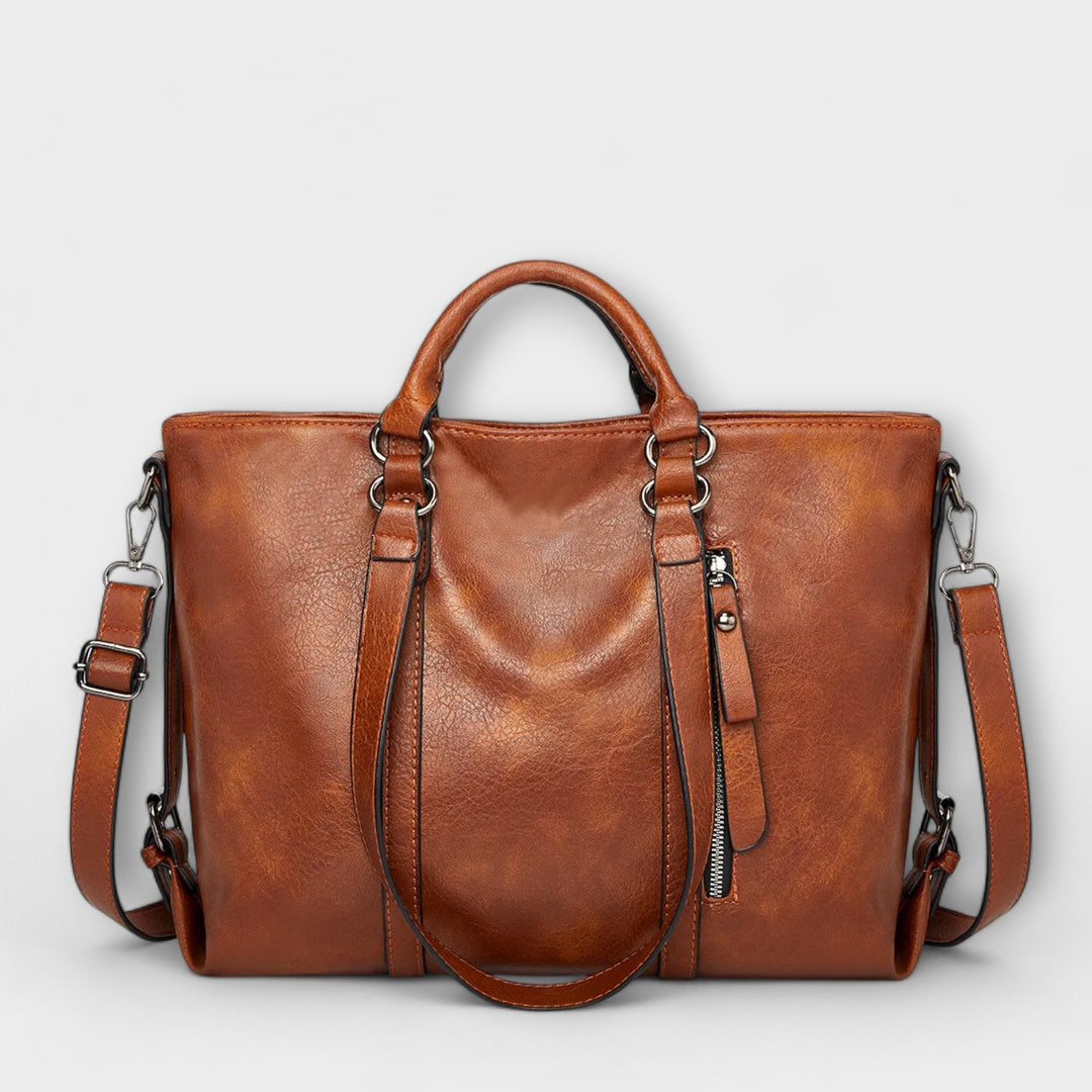 Grand sac cabas en cuir marron pour femme, idéal pour le bureau ou le voyage.