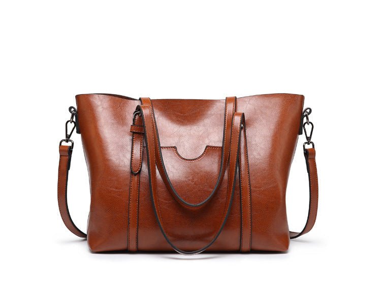 Sac à main cabas en cuir véritable, spacieux et chic, parfait pour la femme active moderne.