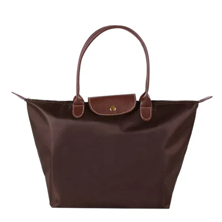 Sac cabas femme, accessoire mode pliable élégant pour un style polyvalent et une utilisation quotidienne.